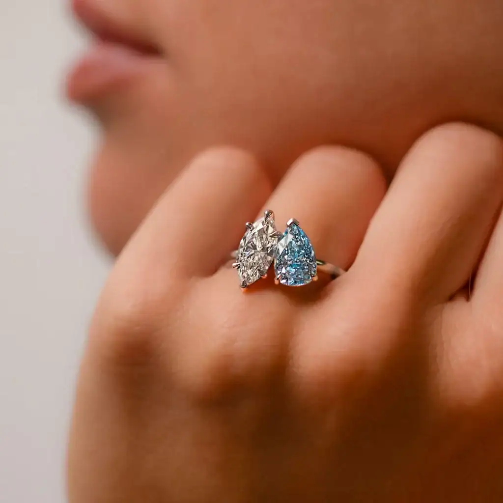 Delicate silver ring featuring a stunning teardrop-shaped diamond and aquamarine stones, perfect for sophisticated jewellery lovers.