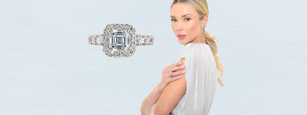 Stunning emerald cut diamond ring with diamond-encrusted band, perfect for engagements or special occasions.