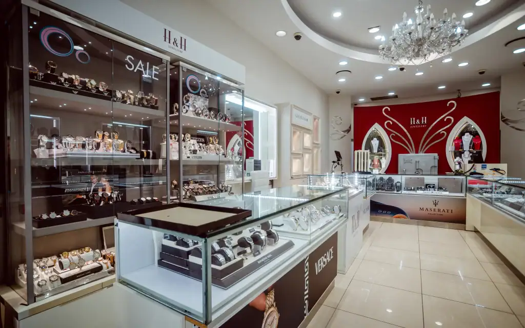 High-quality jewellery store showcasing watches and accessories in a bright, modern setting.