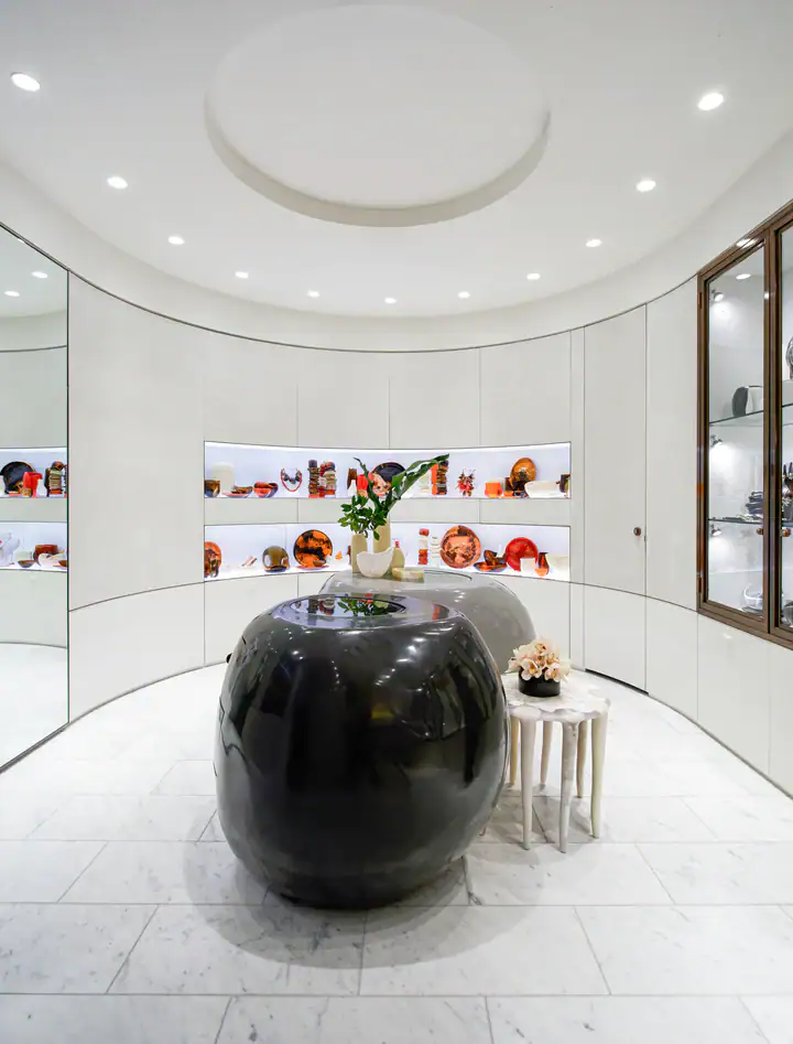 Luxury jewellery store interior with glass display cases and decorative artifacts.