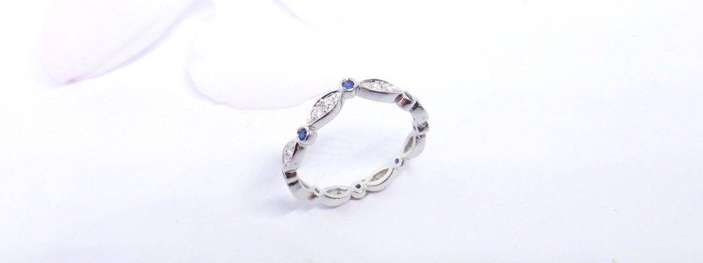 Stunning silver ring featuring blue sapphires and diamonds, perfect for elegant occasions.