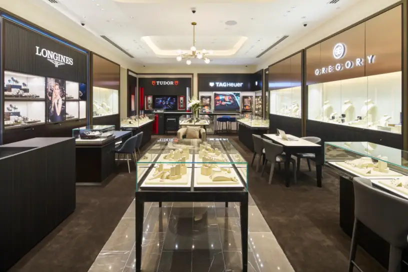Elegant watch store displaying prestigious brands with luxurious displays and lighting, ideal for luxury timepieces.