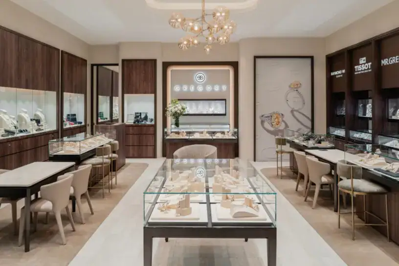 Alt text: Luxurious jewellery boutique with display cases and modern decor.