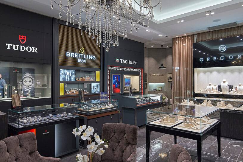 Elegant luxury watch and jewellery boutique with brand showcases and display cases.