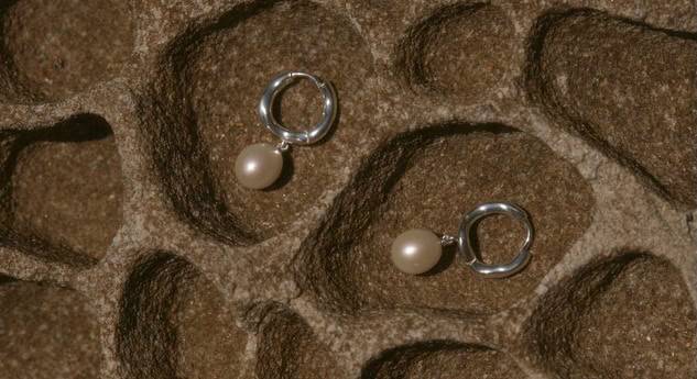 Elegant pearl and silver hoop earrings for women, perfect for any occasion.