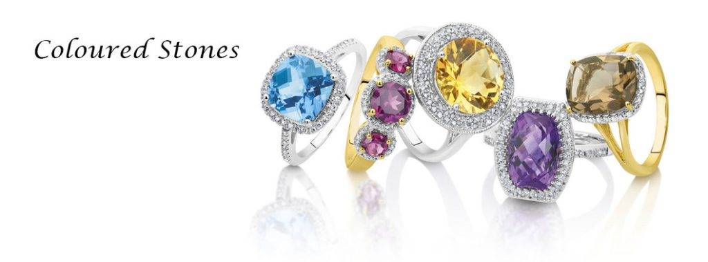 Unique gemstone rings with vibrant, coloured stones and elegant designs in gold and silver.