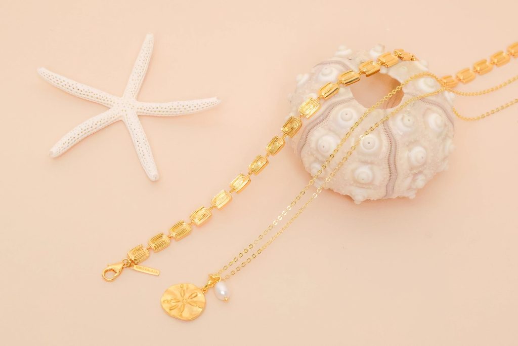 Pearl and gold jewellery styled for a Jewellink offers guide